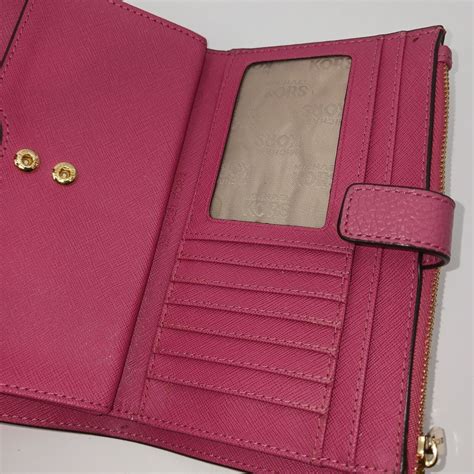 michael kors bright orange wallet|Michael Kors pink wristlet wallet.